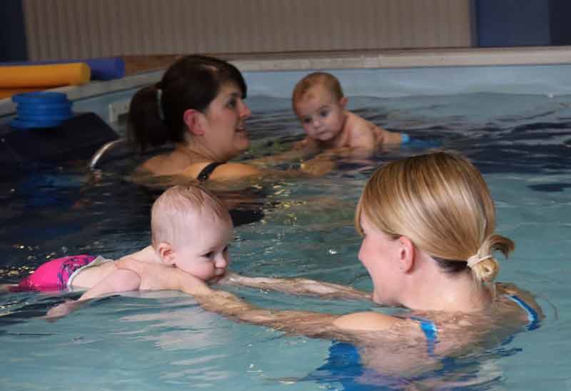 Baby swims with mum at Swimkidz swimming lessons